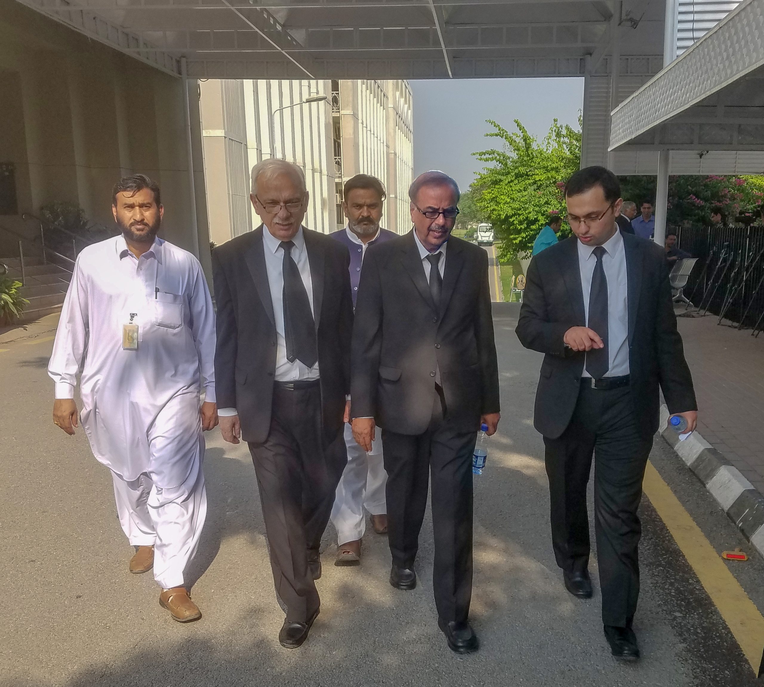Munir A. Malik walks out of the Supreme Court
